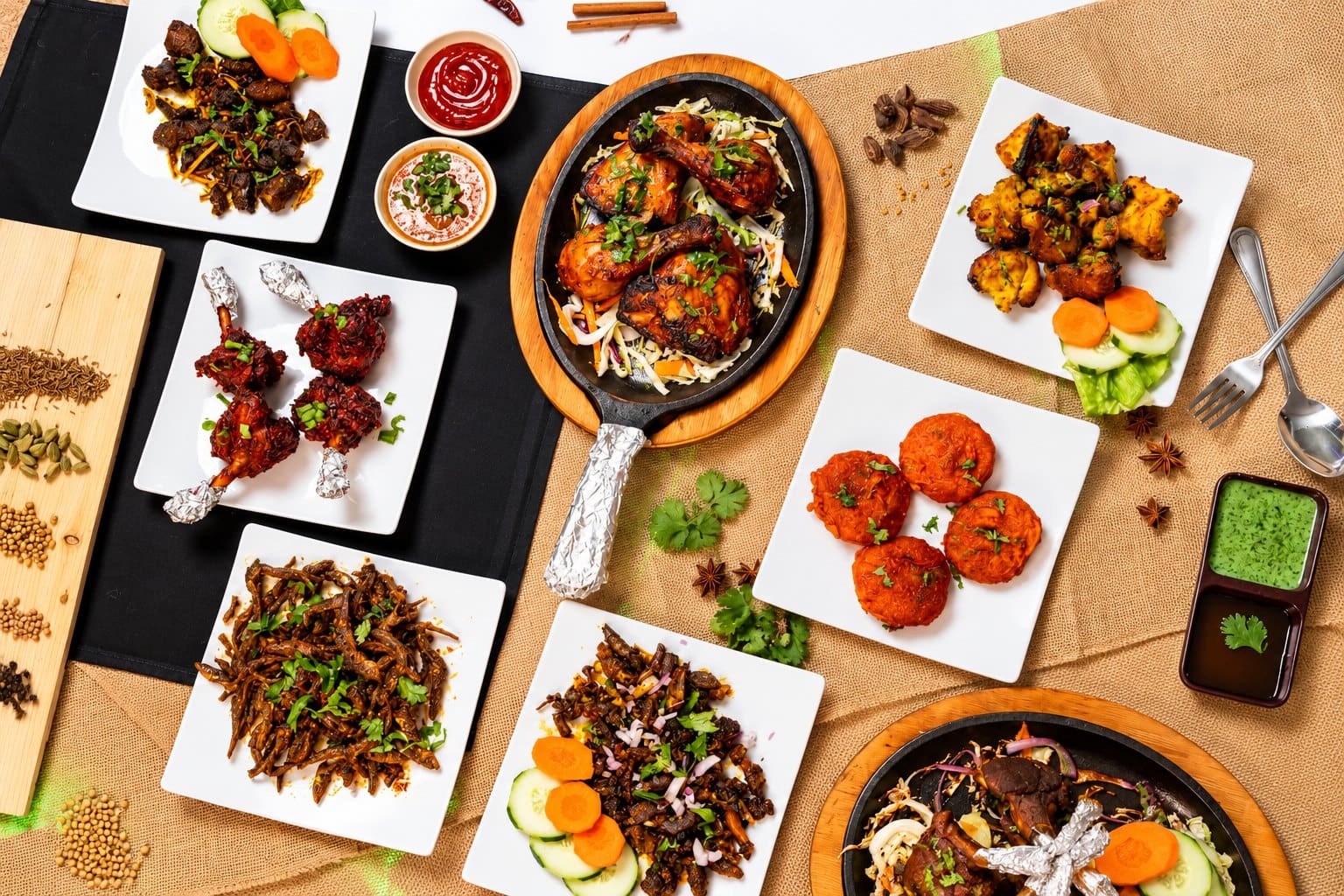 Tandoori, chicken lollipops and appetizers on the table